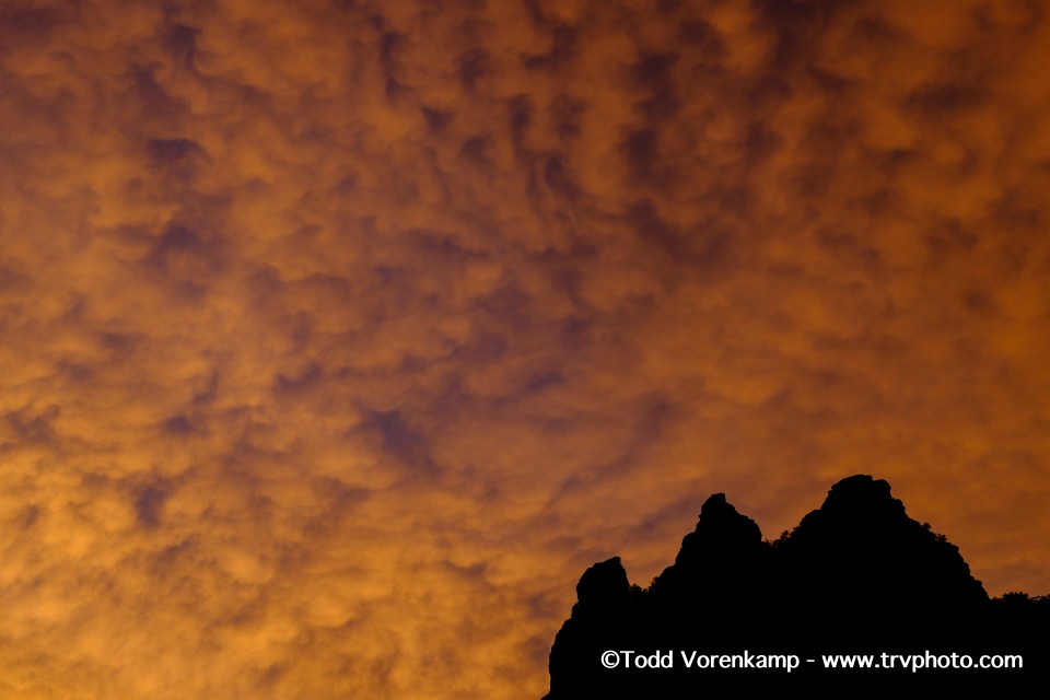 Sky, clouds, mountain, and watermark. One of those does not belong. Sky, clouds, mountain, and watermark. One of those does not belong.
